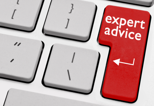 Keyboard with text saying "expert advice" with a red background